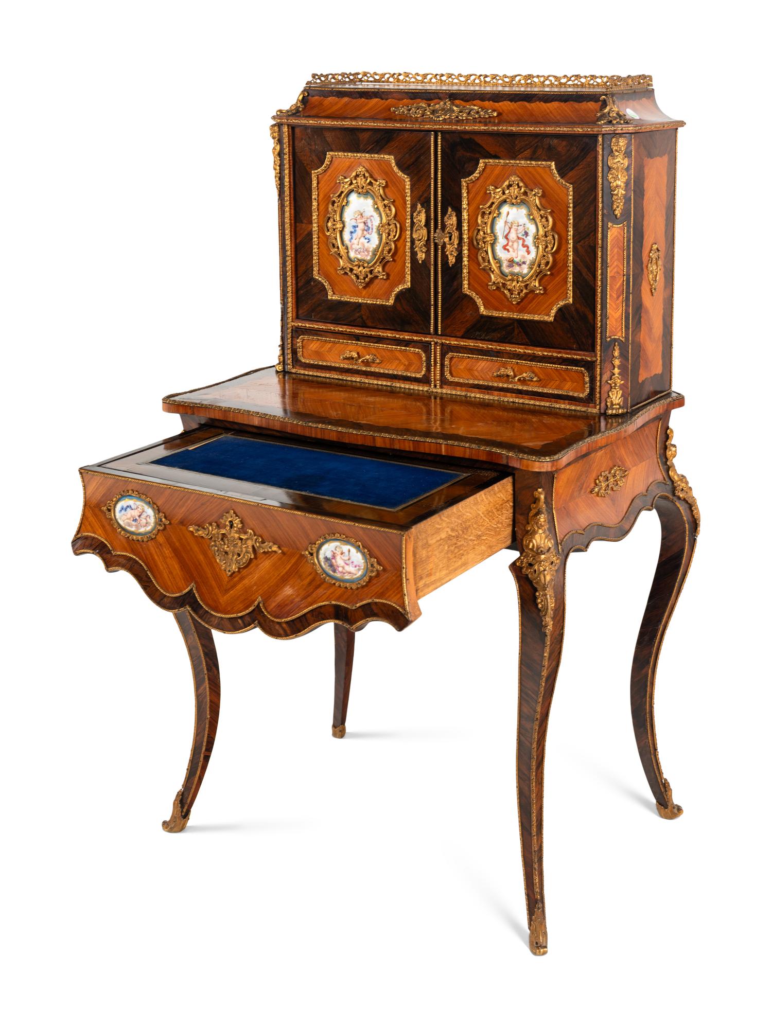 A Napoleon III Gilt Bronze and Porcelain Mounted Kingwood and Rosewood Bonheur du Jour