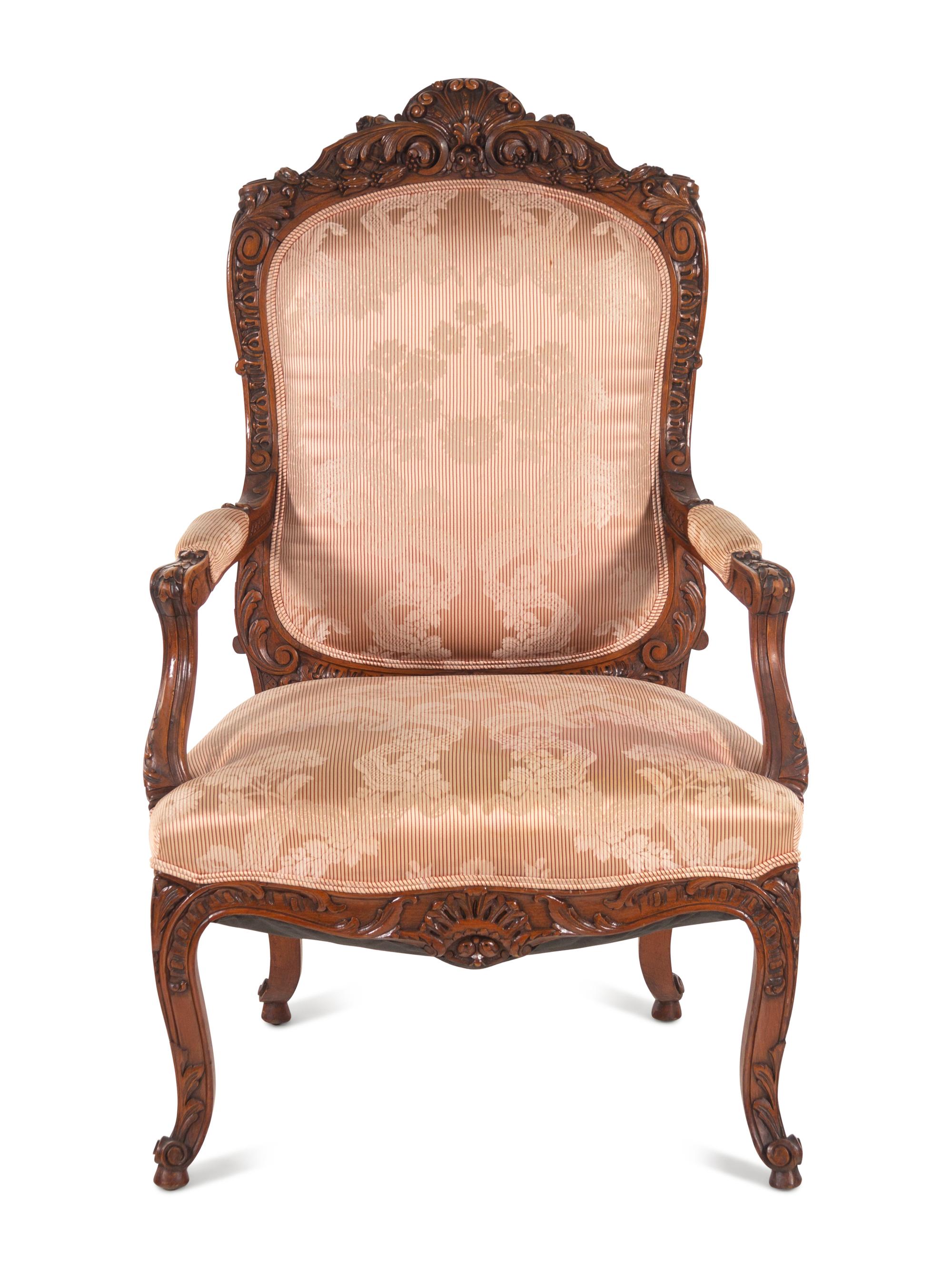 A Louis XV Style Carved Walnut Fauteuil