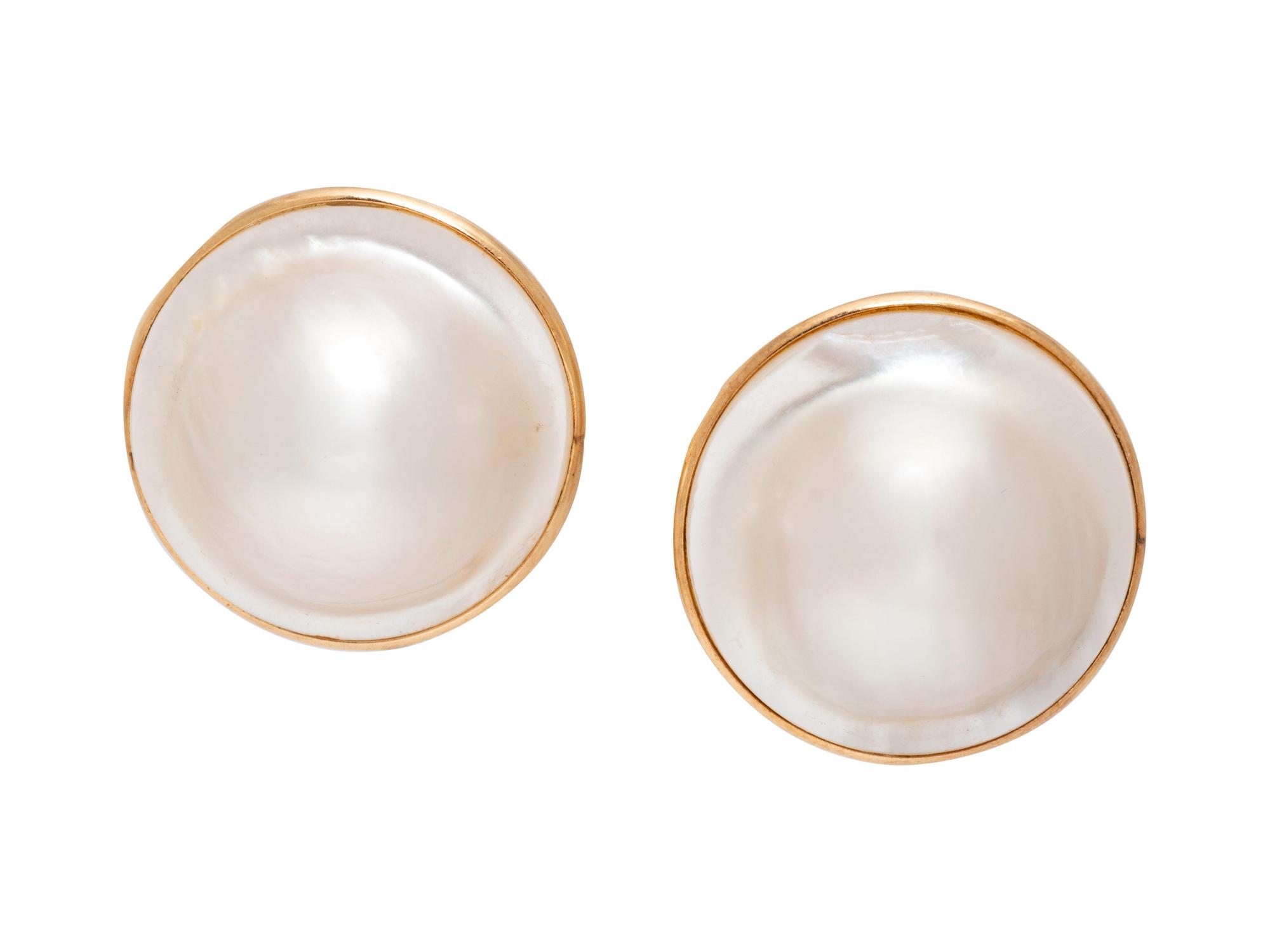 A Pair of 14 Karat Yellow Gold Mabe Pearl Earclips,