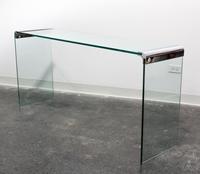A Chrome and Glass Cocktail Table Length of top 57 inches overall. — 20TH CENTURY