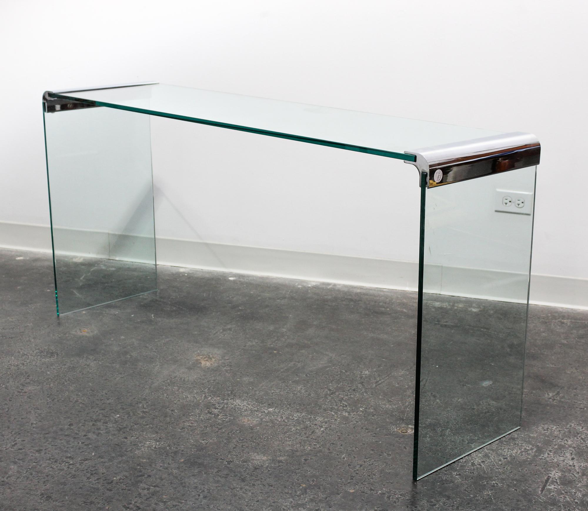 A Chrome and Glass Cocktail Table Length of top 57 inches overall. — 20TH CENTURY