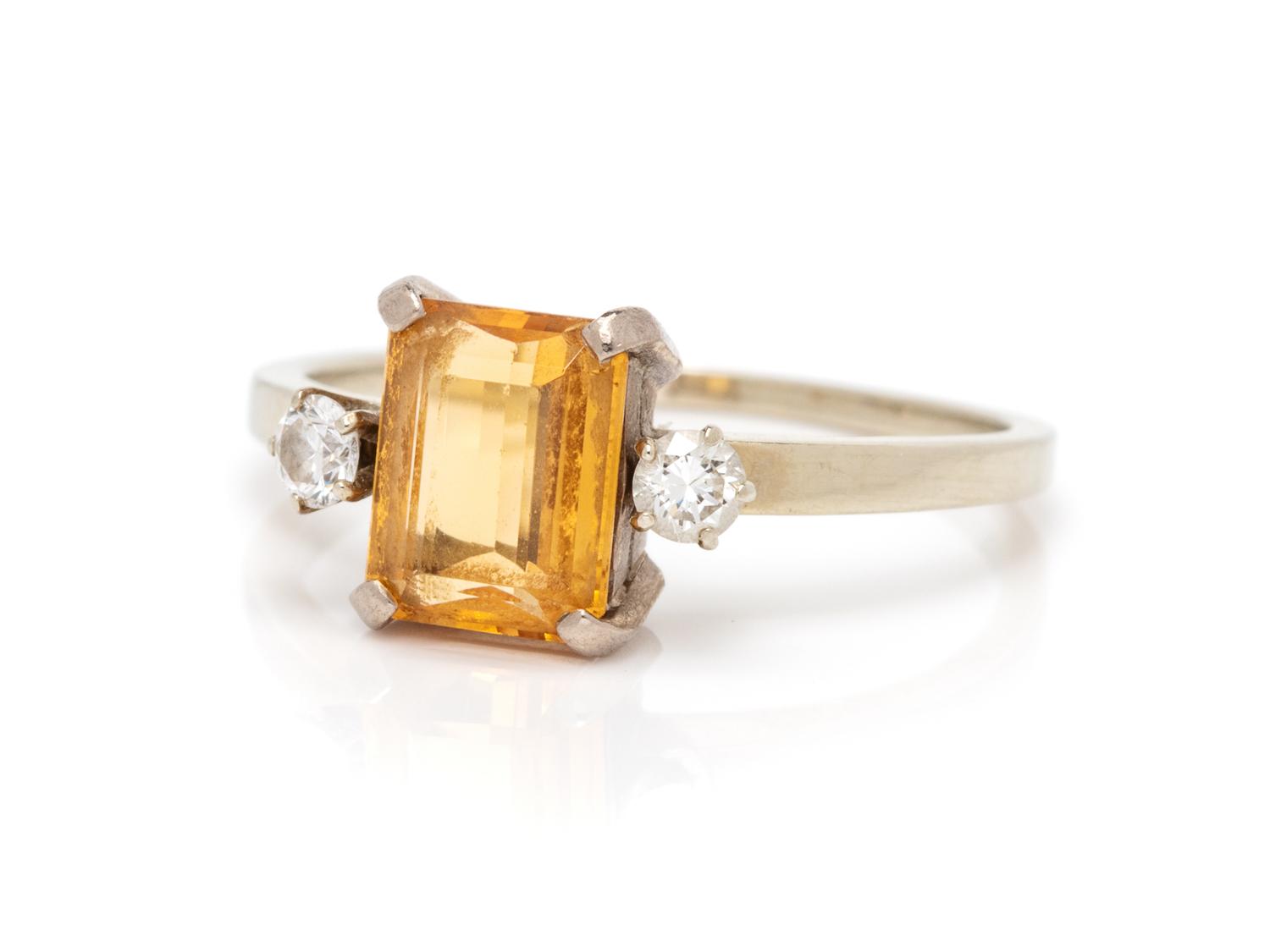 An 18 Karat White Gold, Topaz and Diamond Ring,