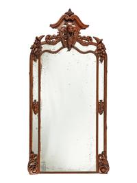 A Monumental Black Forest Carved Mirror