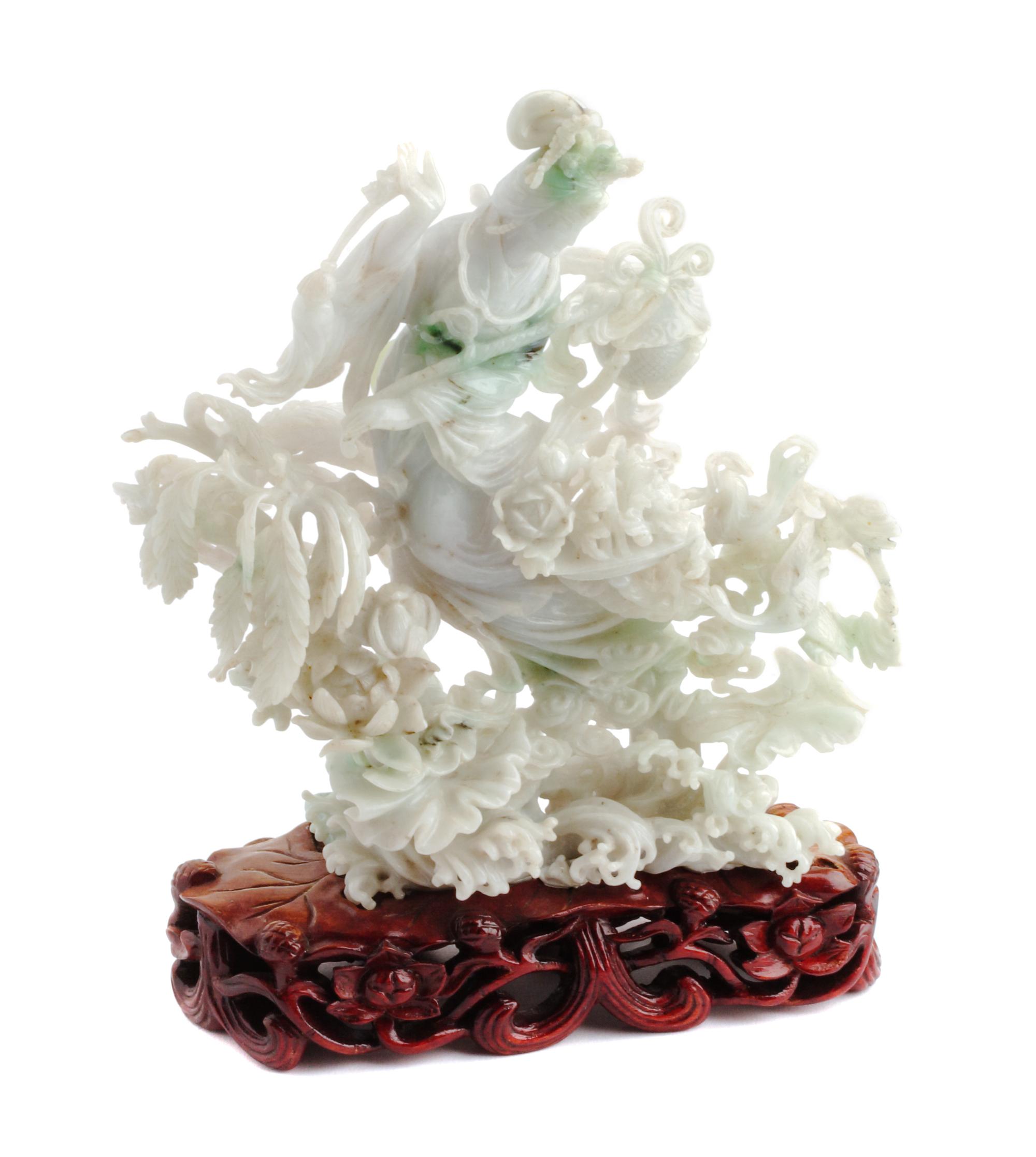 A Chinese Carved Jadeite Figure Height 7 inches.
