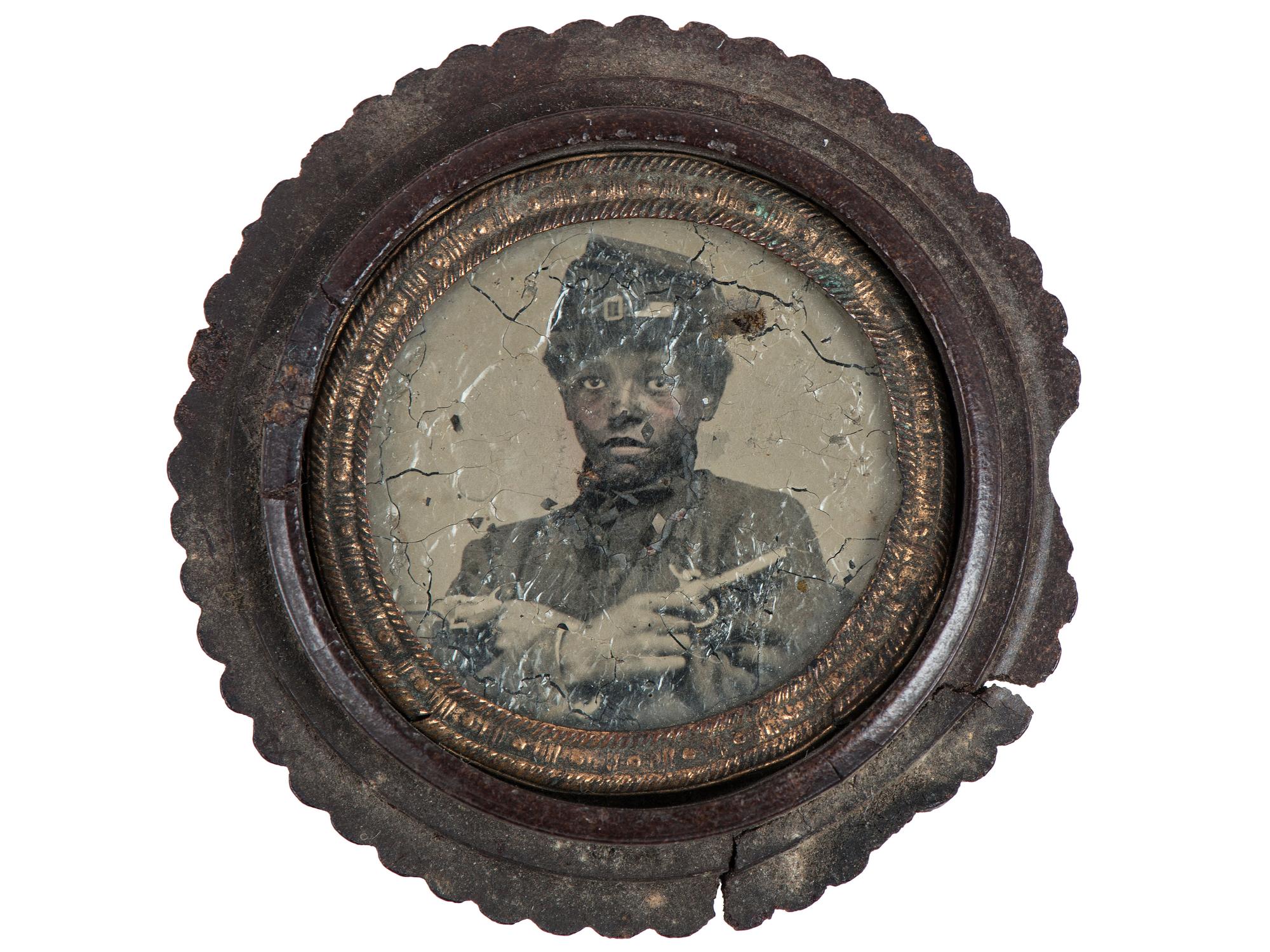 [CIVIL WAR]. Civil War gem tintype of armed African American soldier. Ca 1860s.
