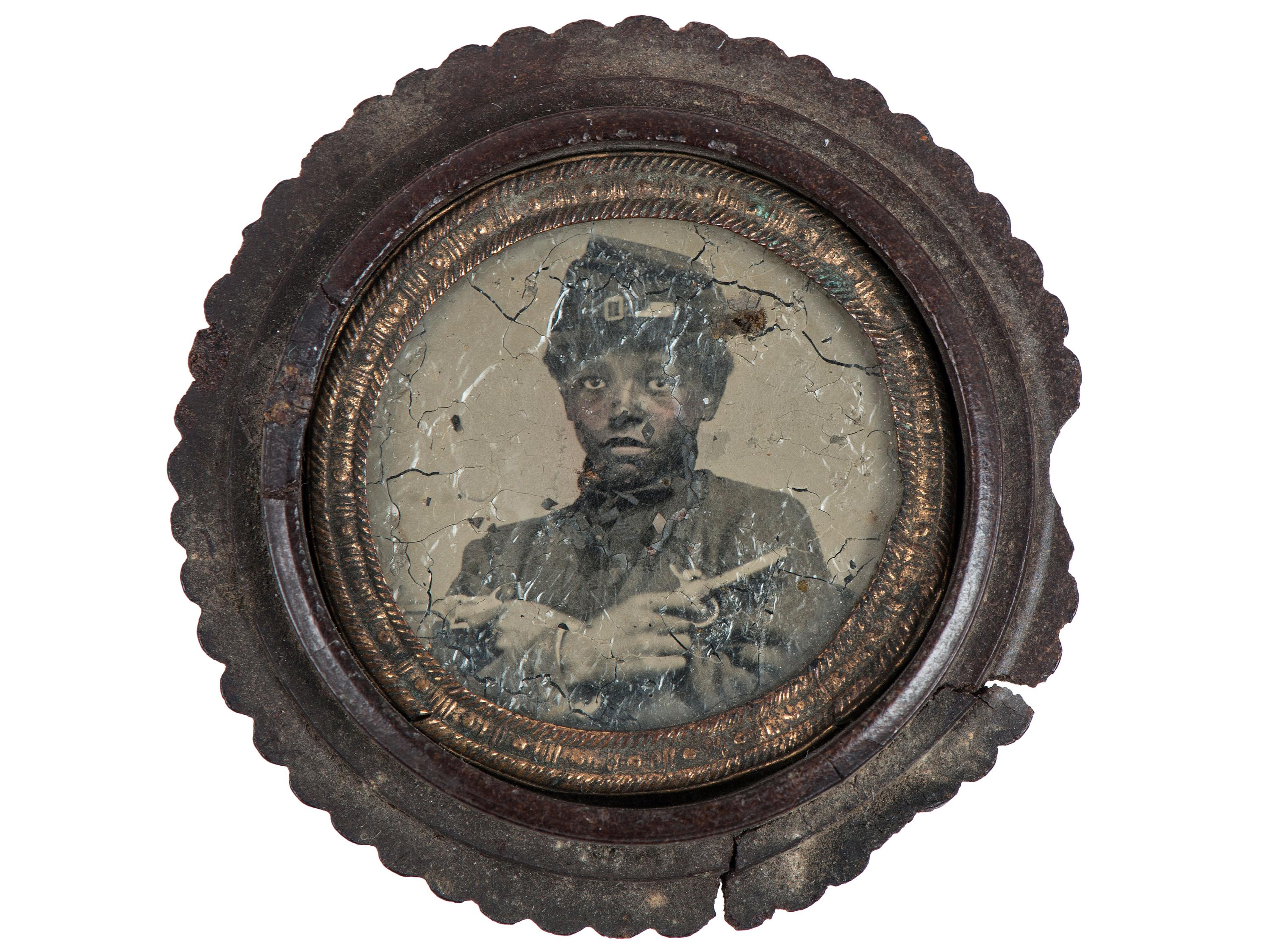 [CIVIL WAR]. Civil War gem tintype of armed African American soldier. Ca 1860s.