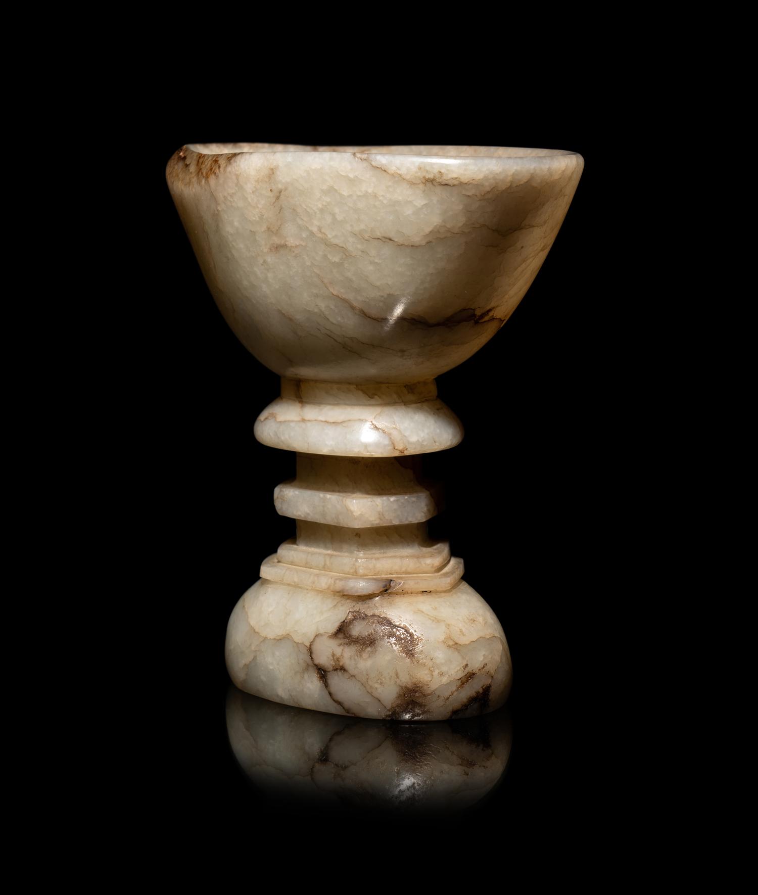 A Chinese Dark Russet White Jade Offering Bowl