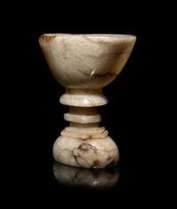 A Chinese Dark Russet White Jade Offering Bowl