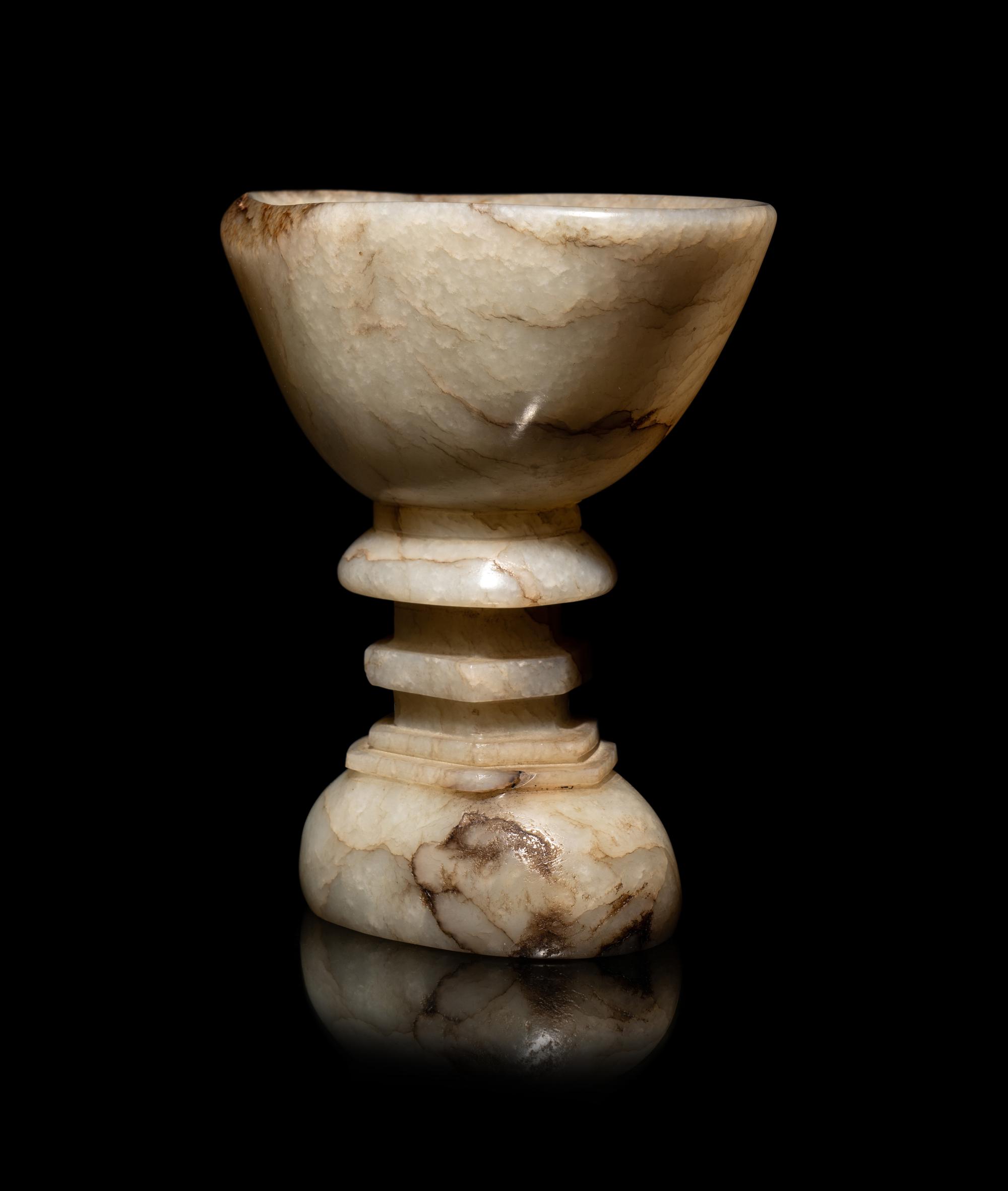A Chinese Dark Russet White Jade Offering Bowl