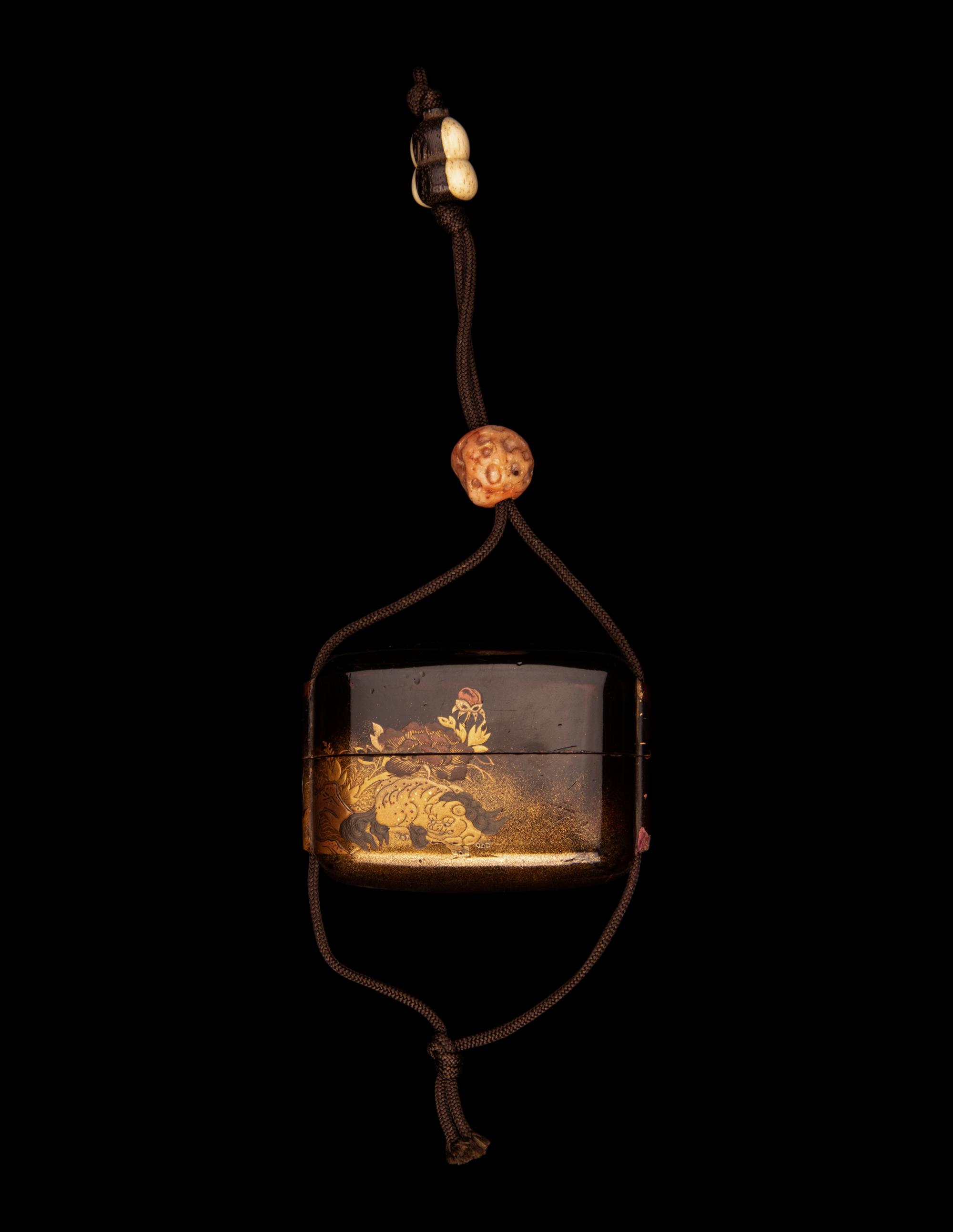 A Japanese Gold and Dark Brown Lacquer Single-Case Inro