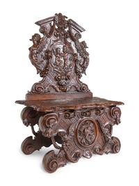 A Pair of Italian Baroque Style Carved Walnut Benches