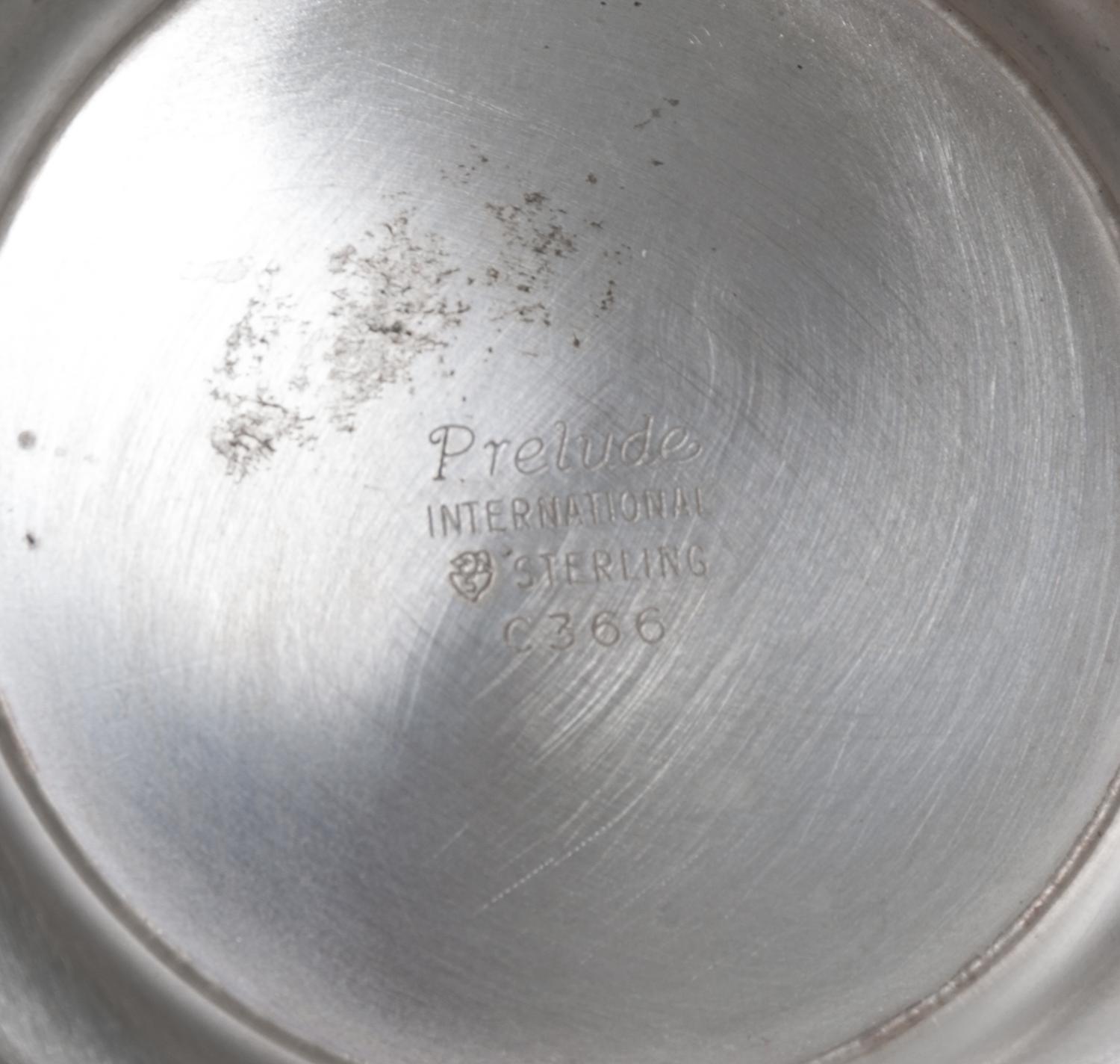 An American Silver Five Piece Tea and Coffee Service, Internation Sterling Co., Meriden, CT, Prelude pattern, comprising a teapot, a co