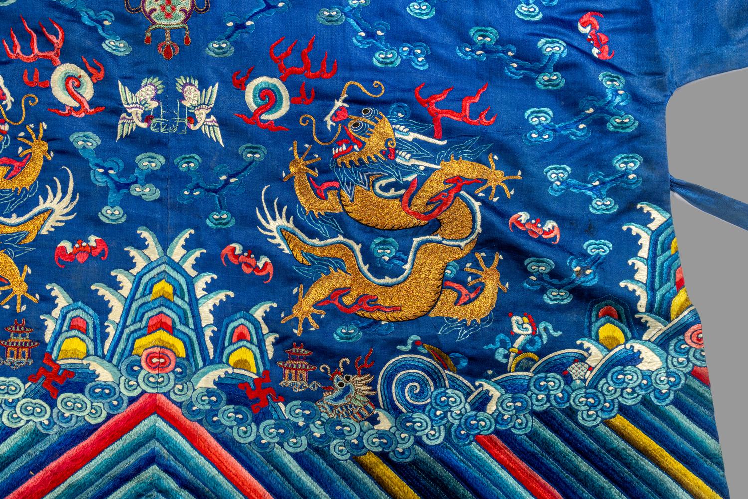 A Chinese Blue Ground Embroidered Silk 'Dragon' Robe