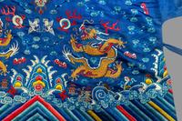 A Chinese Blue Ground Embroidered Silk 'Dragon' Robe