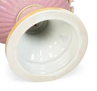 A Sèvres Style Painted Porcelain Lidded Urn with Bisque Floral Swags
