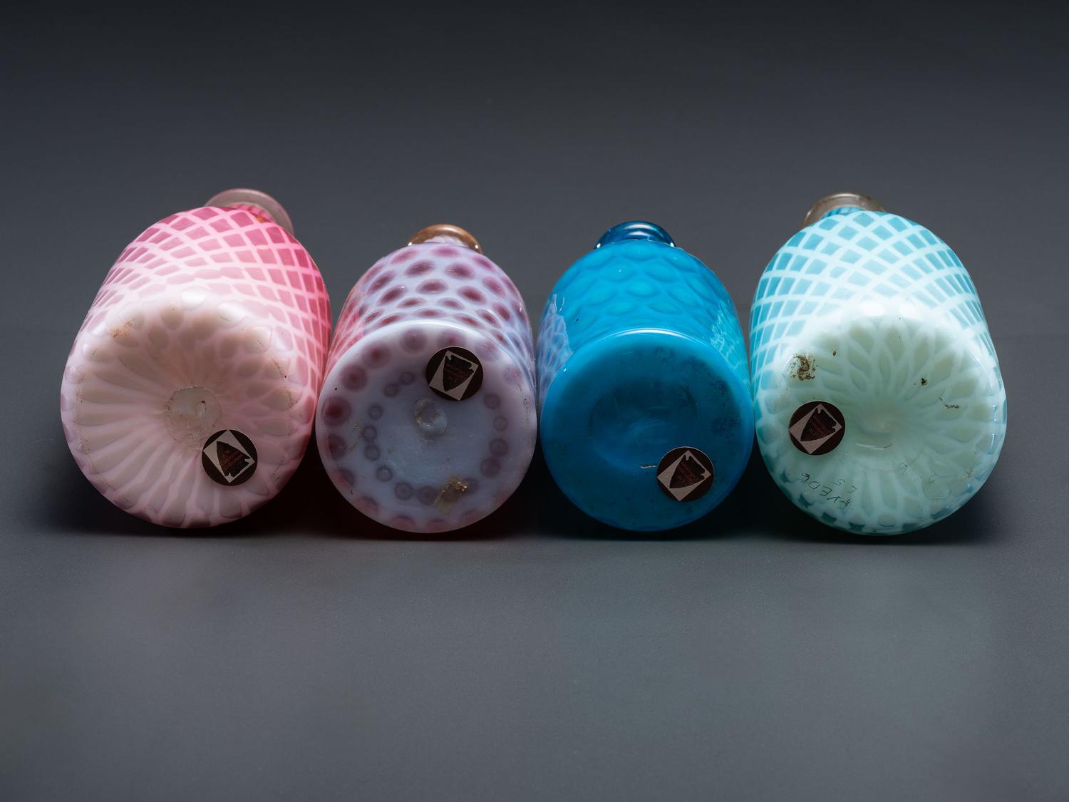 Four Opalescent Glass Barber Bottles