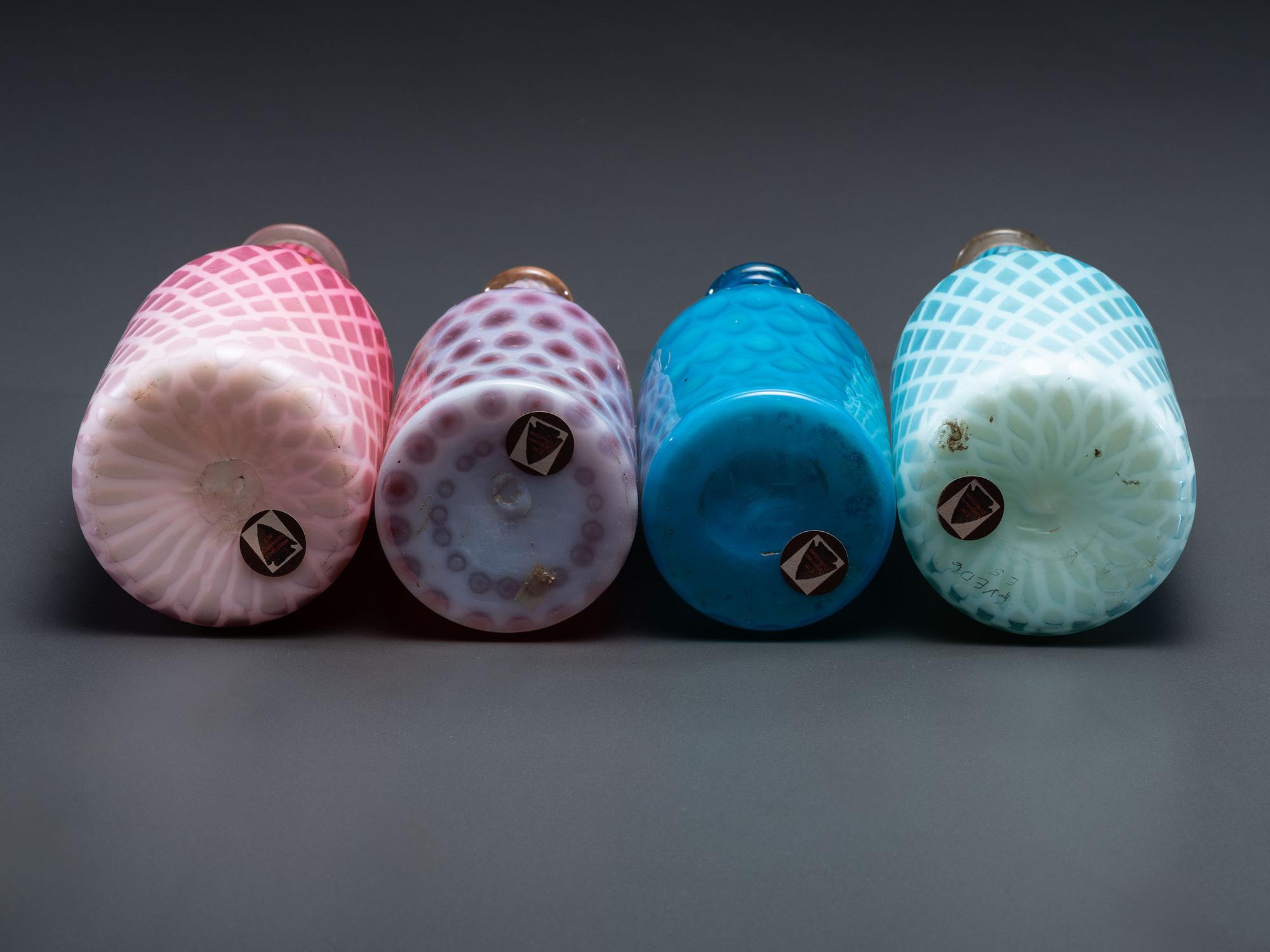 Four Opalescent Glass Barber Bottles