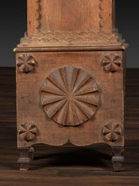 A Folk Art Carved Maple Clock Case