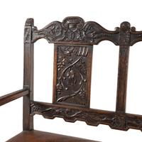 A Continental Carved Oak Hall Bench