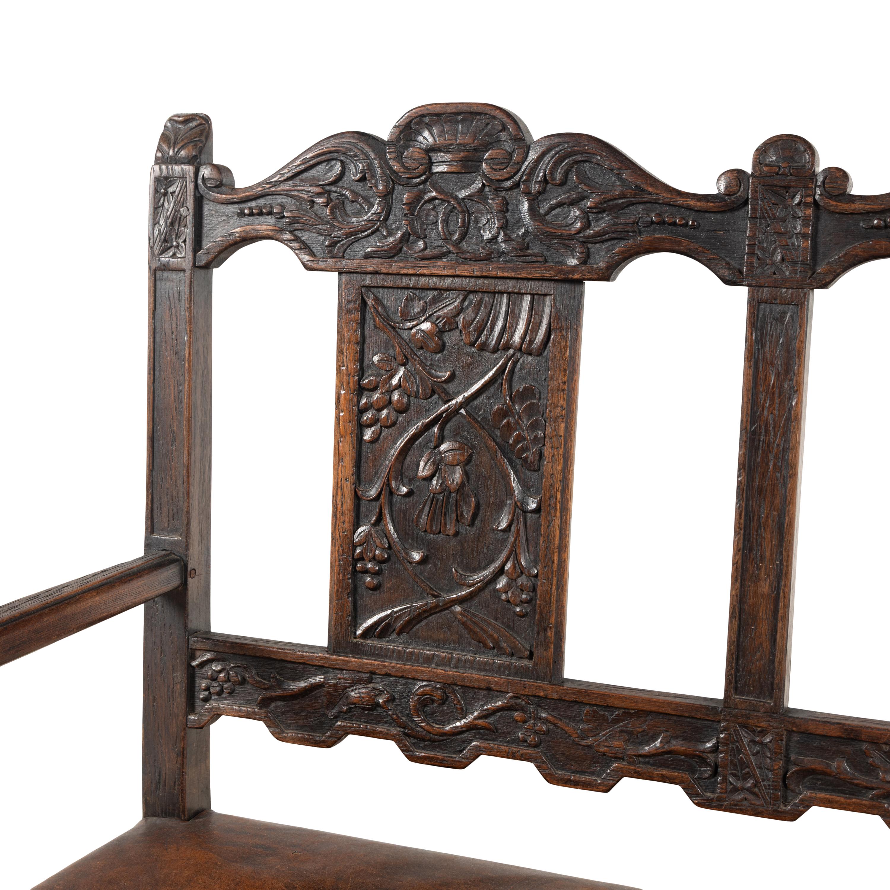 A Continental Carved Oak Hall Bench