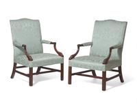 A fine pair of George III mahogany Gainsborough library chairs, circa 1760