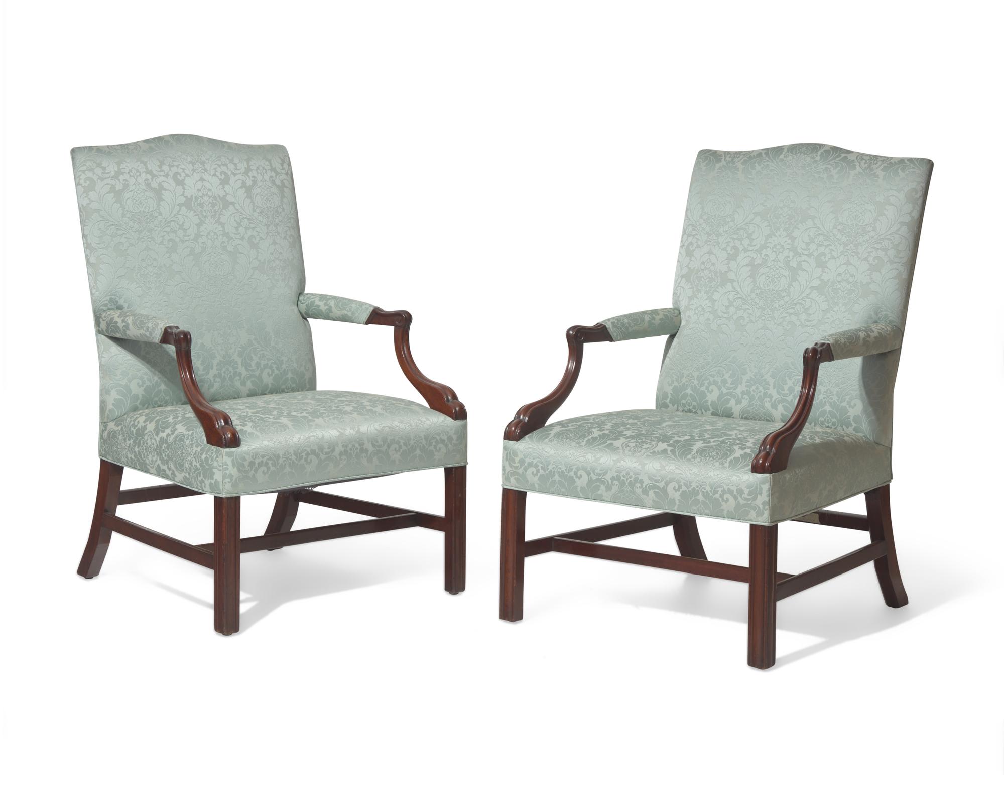 A fine pair of George III mahogany Gainsborough library chairs, circa 1760