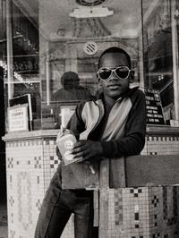 A Boy in Front of the Lowe's 125th Street Movie Theatre, 1976 (printed 2012)