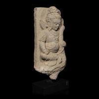 An Indonesian Volcanic Stone Figure of Kumara, Central Java, 10th Century