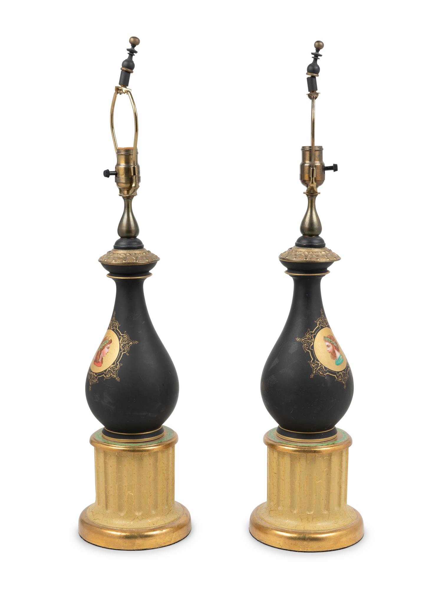 A Pair of Continental Porcelain and Giltwood Lamps