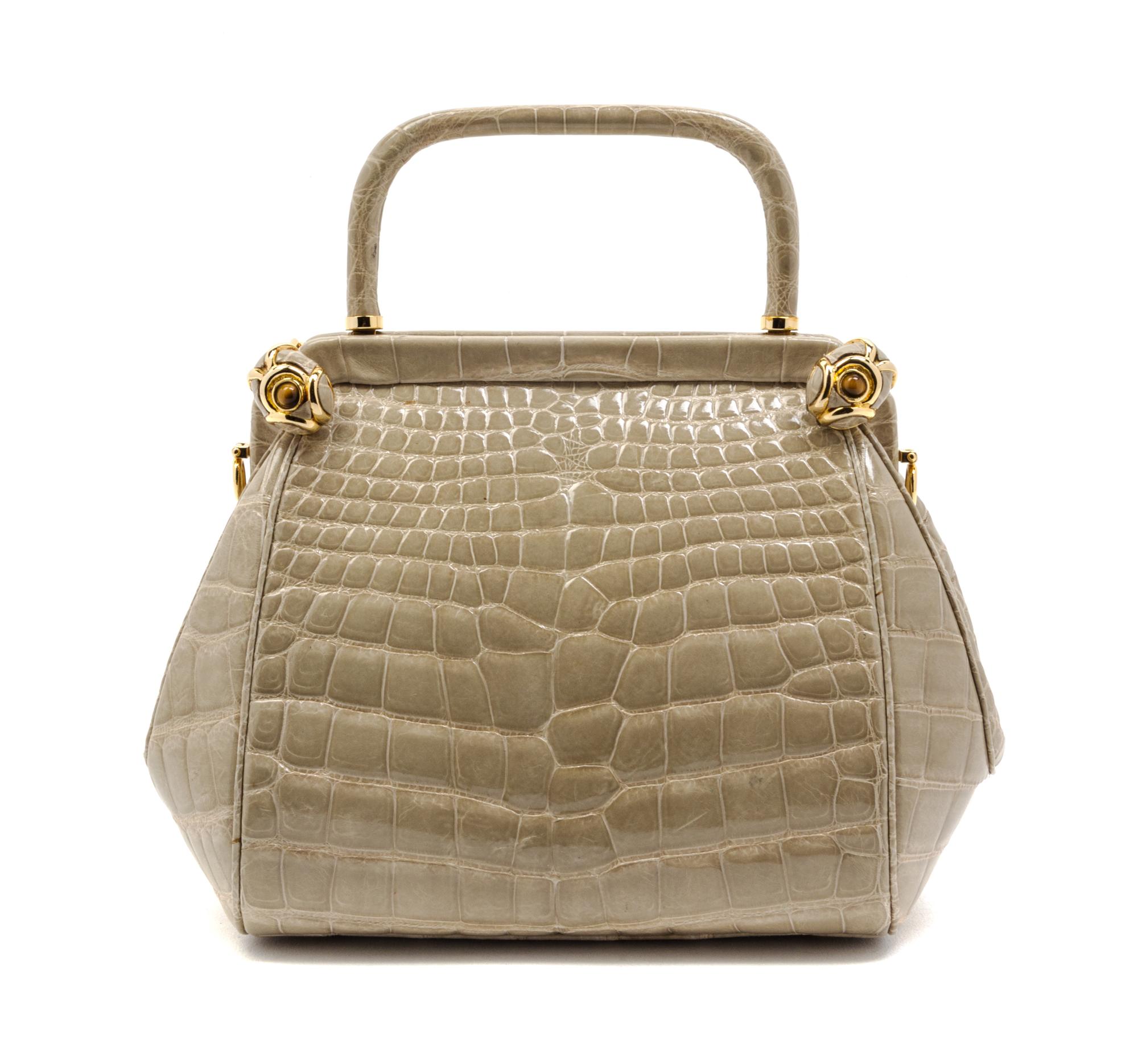 A Judith Leiber Taupe Alligator Evening Bag, 8 1/2 x 6 x 4 inches.