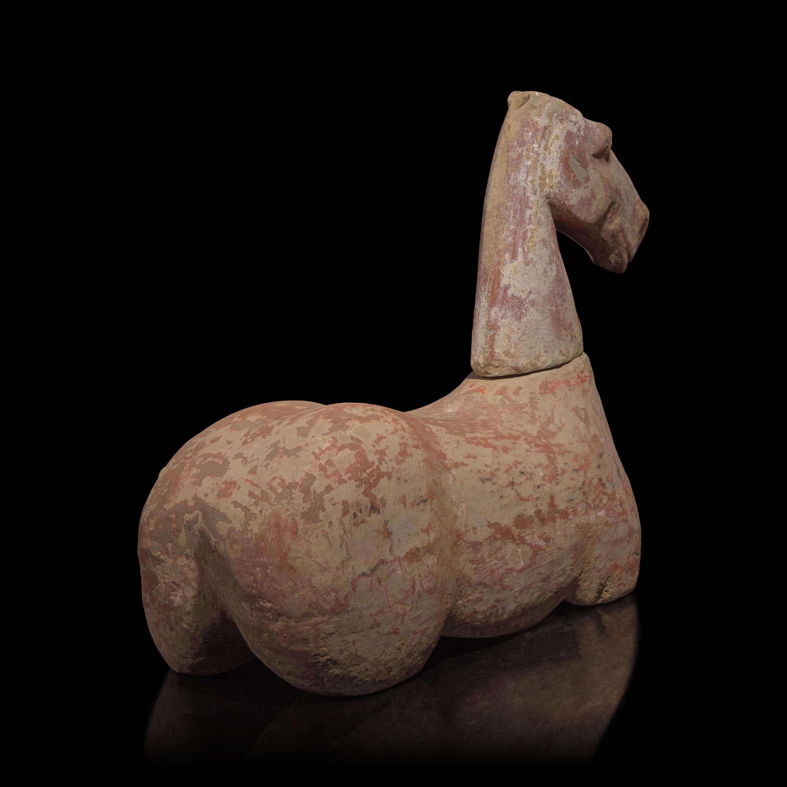 A Chinese Pottery Figure of a Recumbent Horse, Han Dynasty — 漢 彩繪灰陶馬