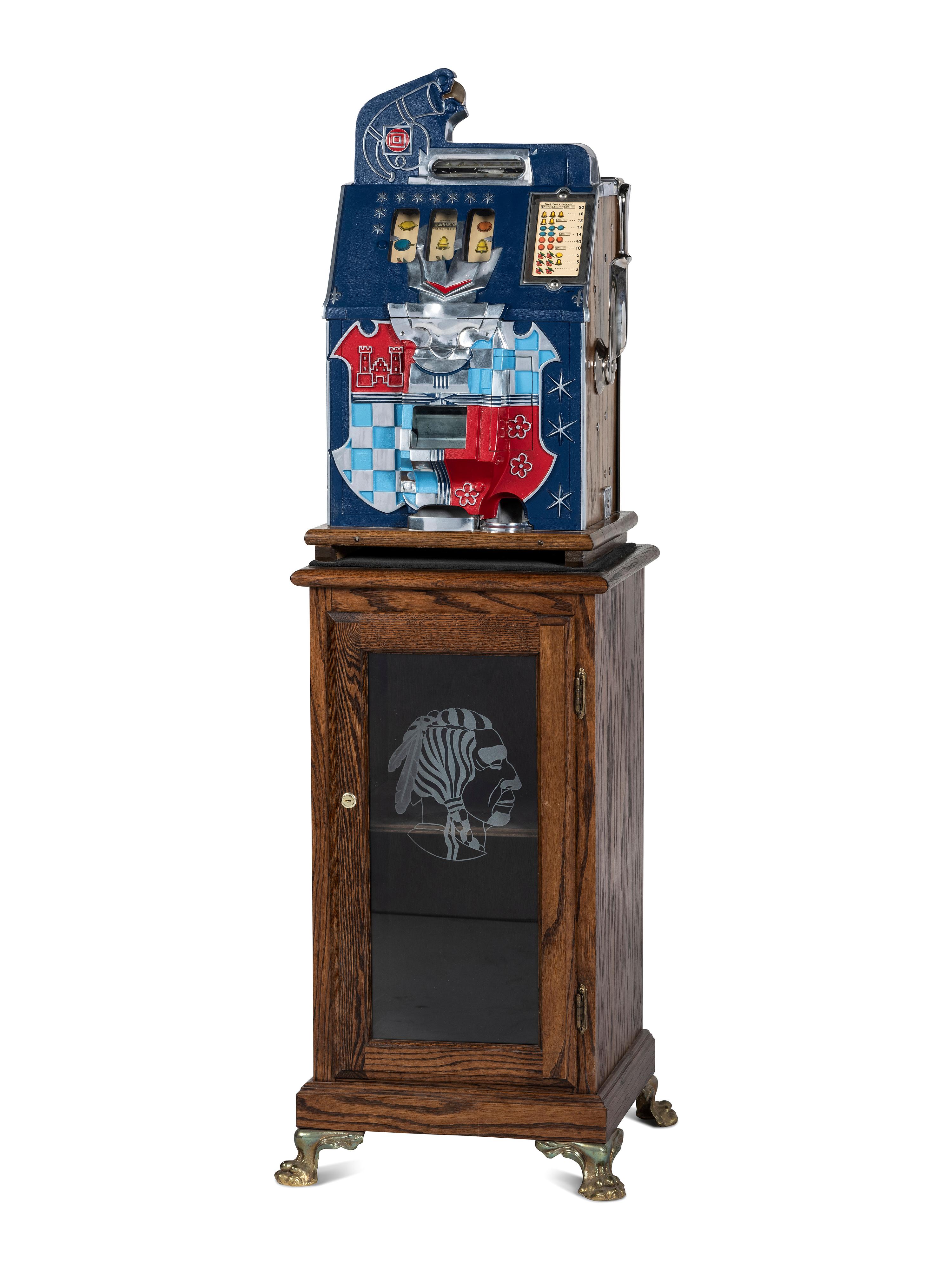 A Mills Novelty Co. Castle Front 50 Cent Slot Machine on Chief's Head Engraved Glass Stand