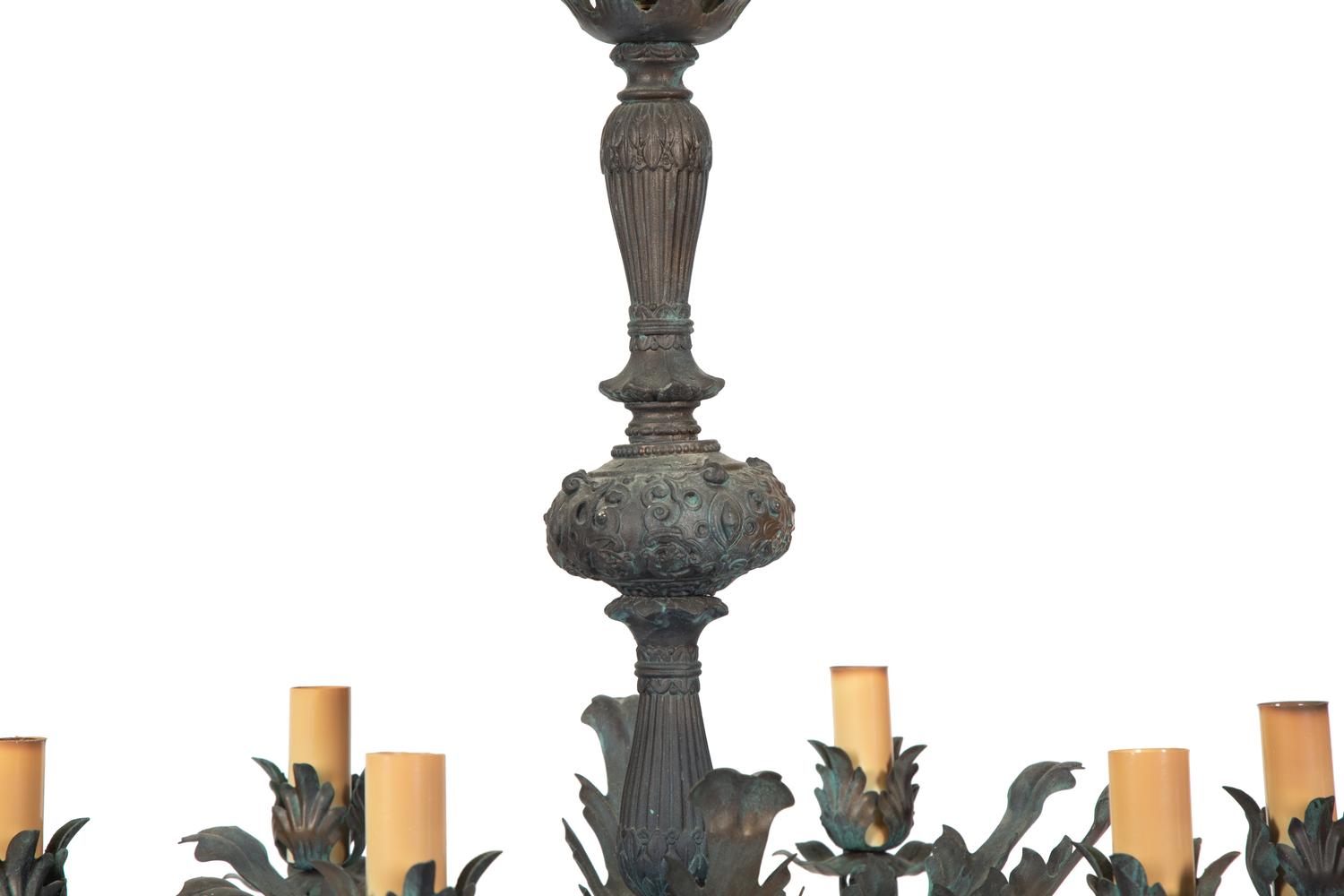 A Rococo Style Patinated Metal Six Light Chandelier