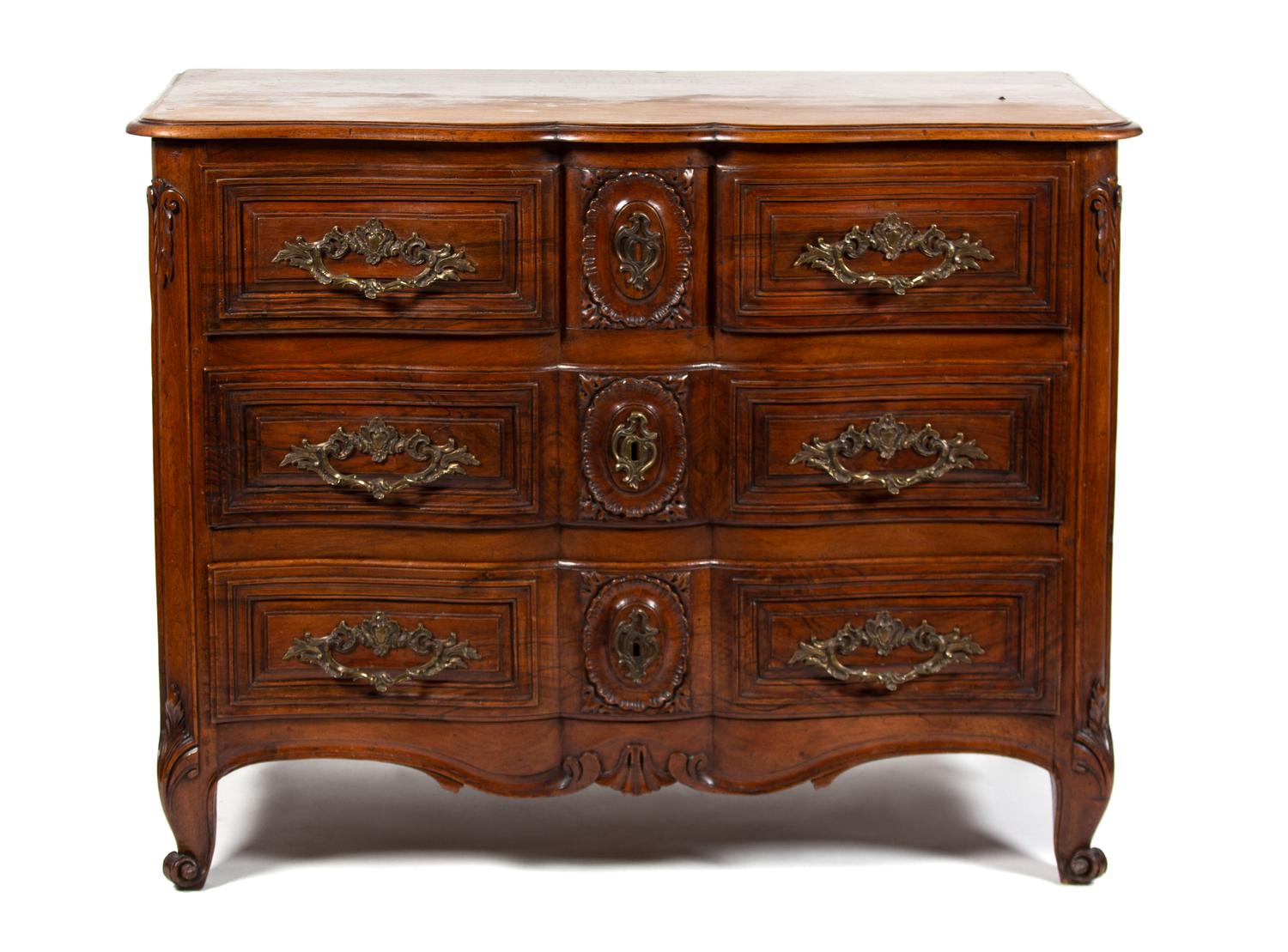 A Louis XV Provincial Style Carved Walnut Commode Height 35 1/4 x width 48 1/2 x depth 25 inches. — 19TH CENTURY