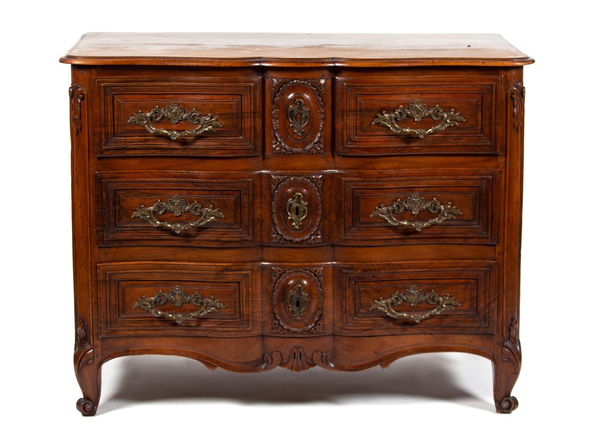 A Louis XV Provincial Style Carved Walnut Commode Height 35 1/4 x width 48 1/2 x depth 25 inches. — 19TH CENTURY