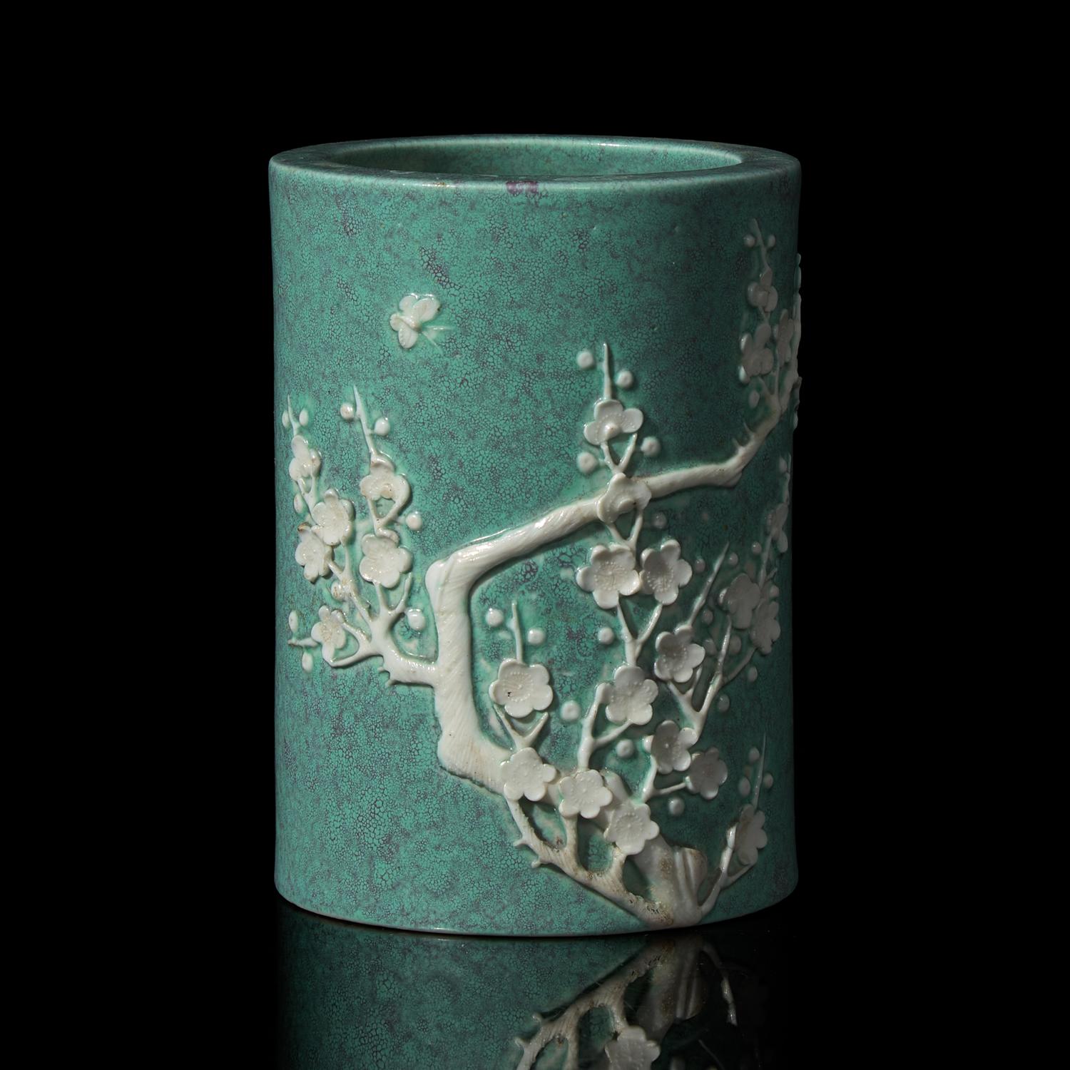 A Chinese "Robin's-Egg" Glazed Porcelain Brushpot, Qing Dynasty, Probably 19th Century — 清晚期 爐鈞釉貼塑梅花圖筆筒