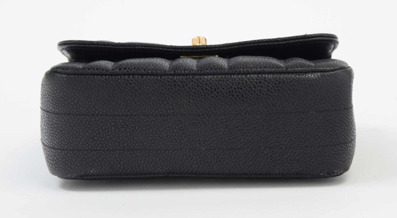 A Chanel Black Caviar Quilted Small Flap Bag, 7" x 5" x 2"; Strap drop: 21".