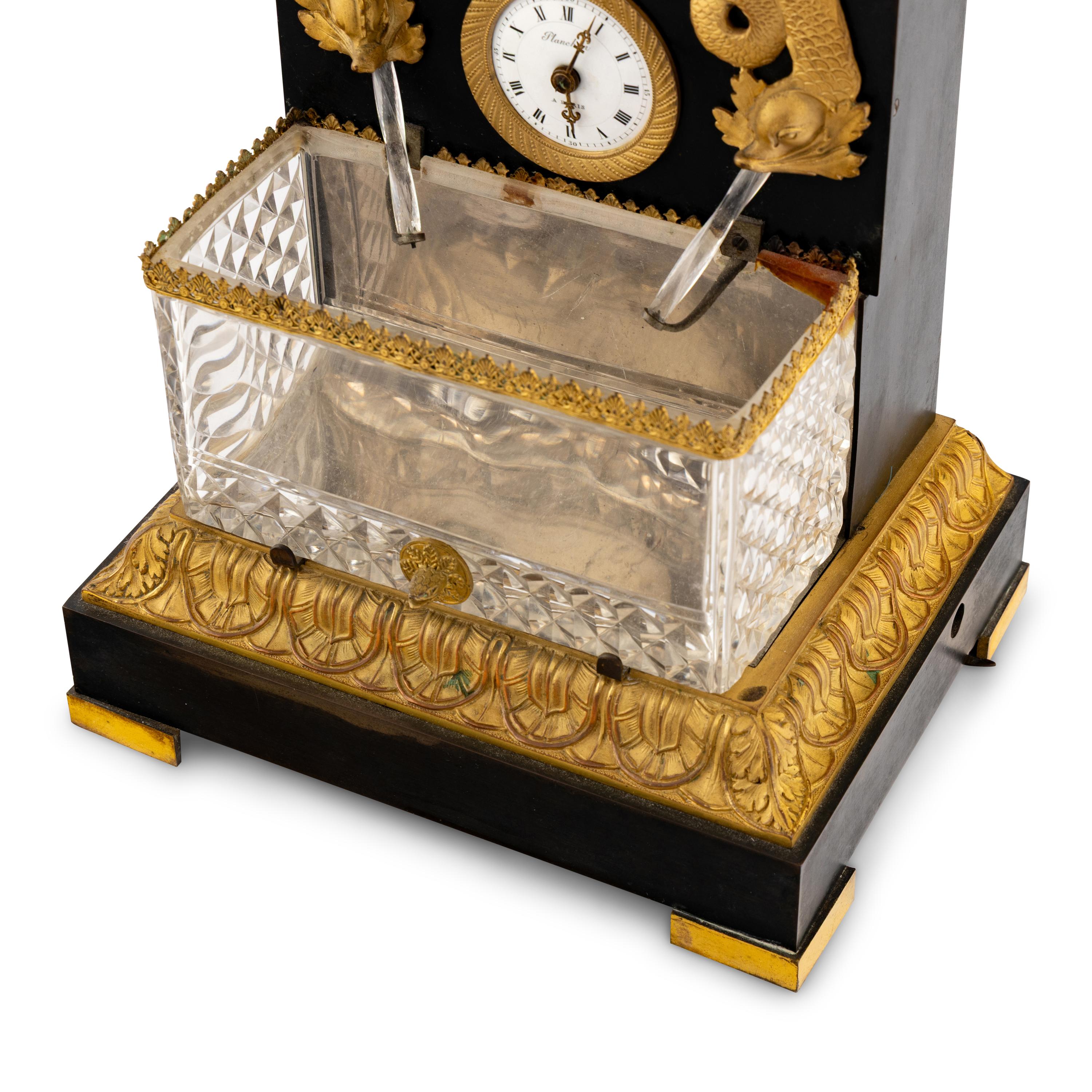 A French Patinated and Gilt Bronze and Cut Glass "Fountain" Mantel Clock