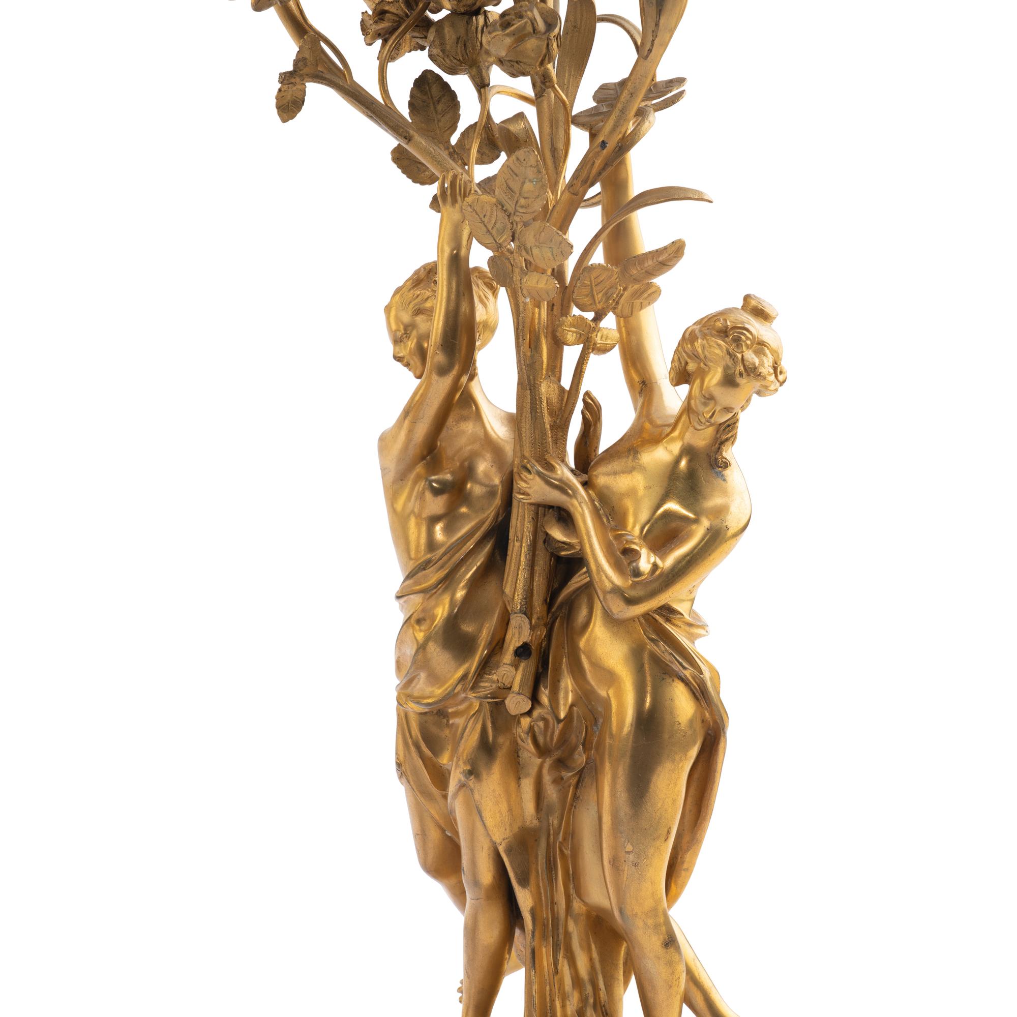 A Louis XVI Style Gilt-Bronze and White Marble Annular Clock Garniture