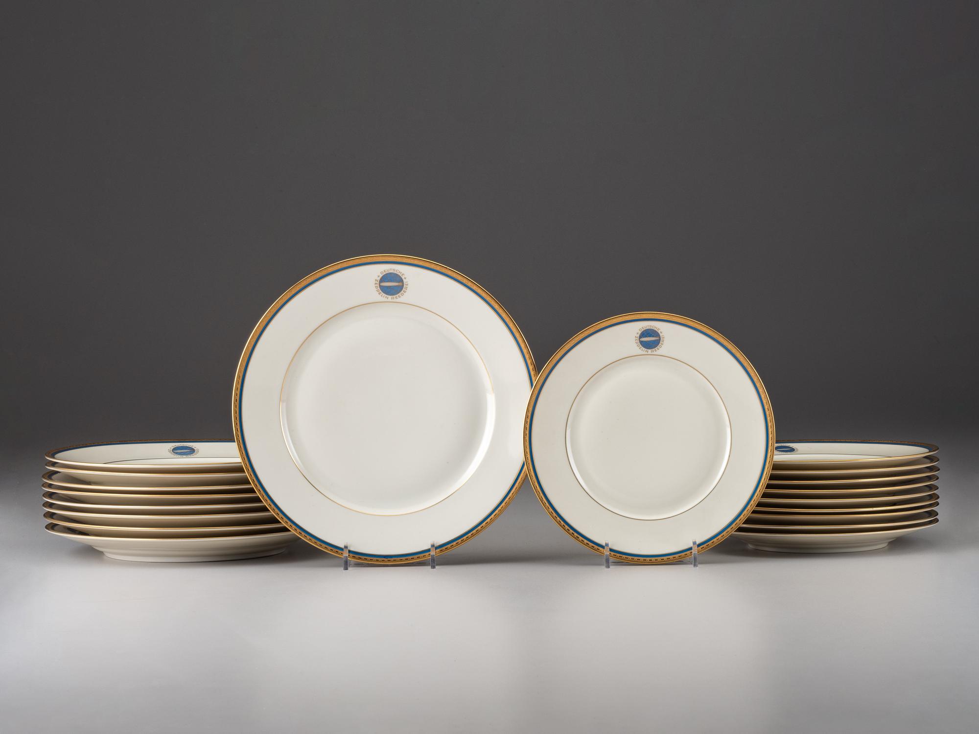 [TRANSPORTATION] - [ZEPPELIN]. Set of Deutsche Zeppelin-Reederei porcelain with dinner plates, salad plates, and sherbet glasses.