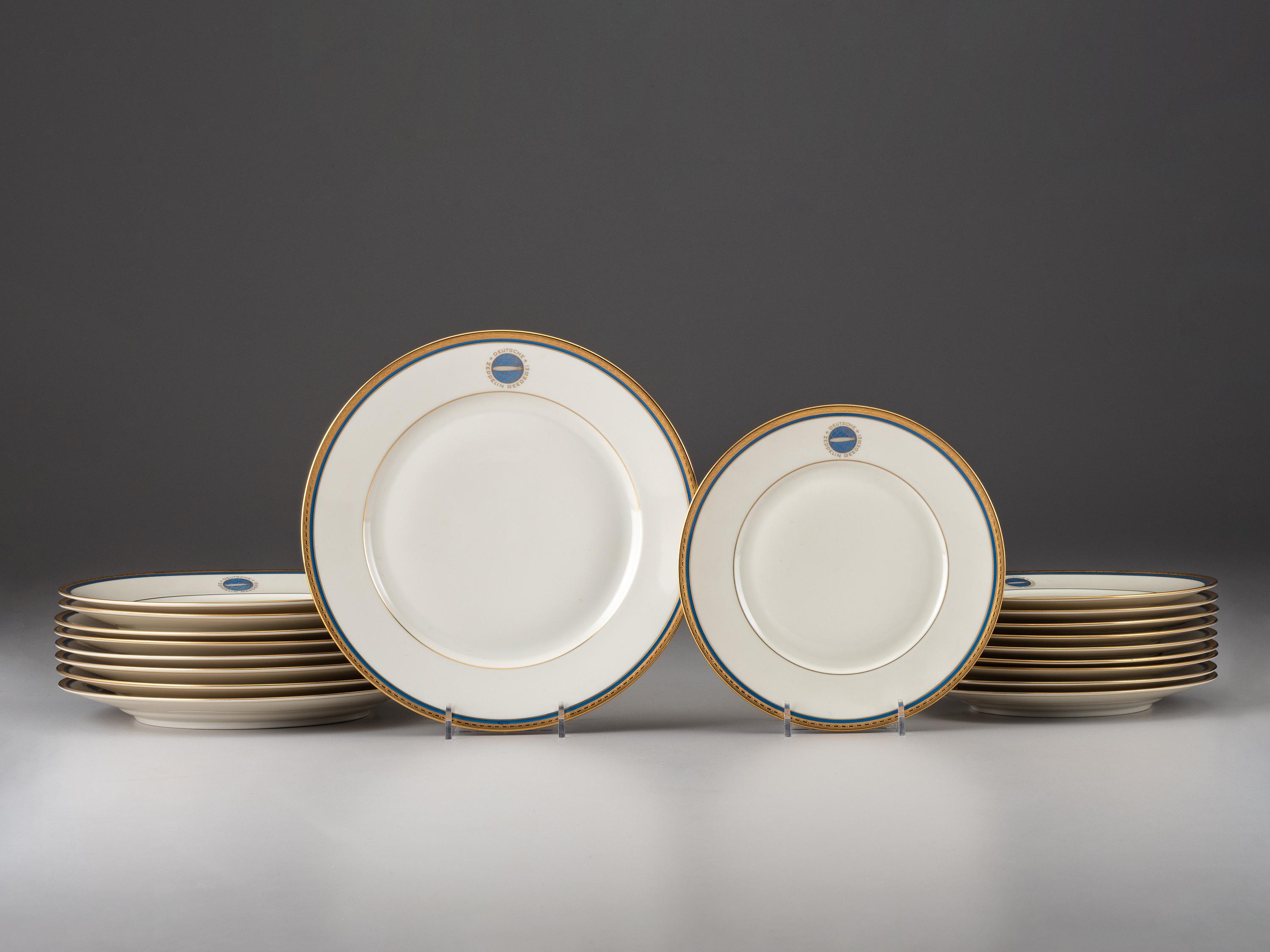 [TRANSPORTATION] - [ZEPPELIN]. Set of Deutsche Zeppelin-Reederei porcelain with dinner plates, salad plates, and sherbet glasses.