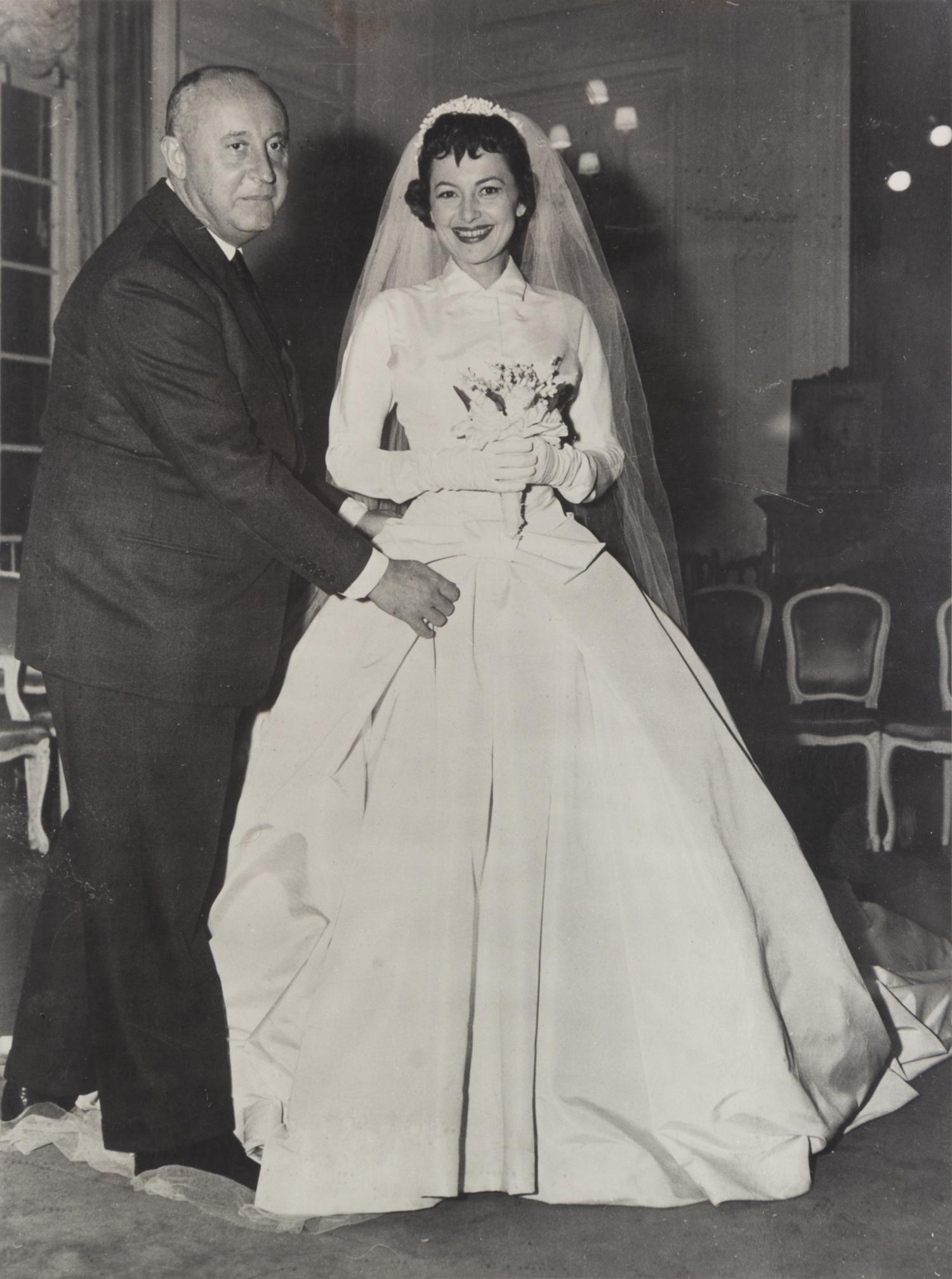 Two Photographic Prints of Olivia de Havilland and Christian Dior and seven Dior fashion show programs with hand-written comments by de Havilland. — From the collection of Olivia de Havilland