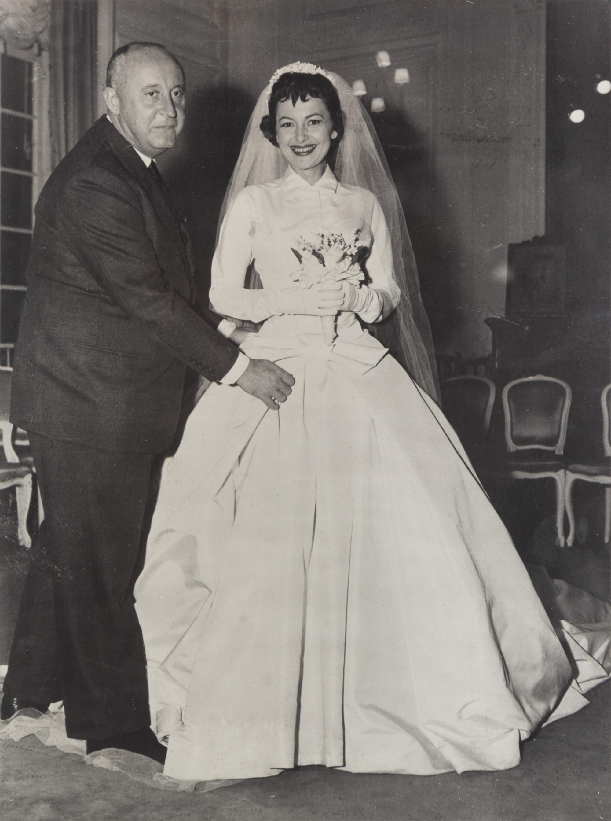 Two Photographic Prints of Olivia de Havilland and Christian Dior and seven Dior fashion show programs with hand-written comments by de Havilland. — From the collection of Olivia de Havilland