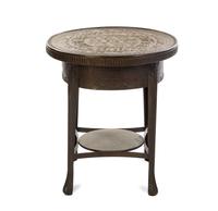 A Middle Eastern Brass Table, Height 26 3/4 x diameter of top 23 1/2 inches.