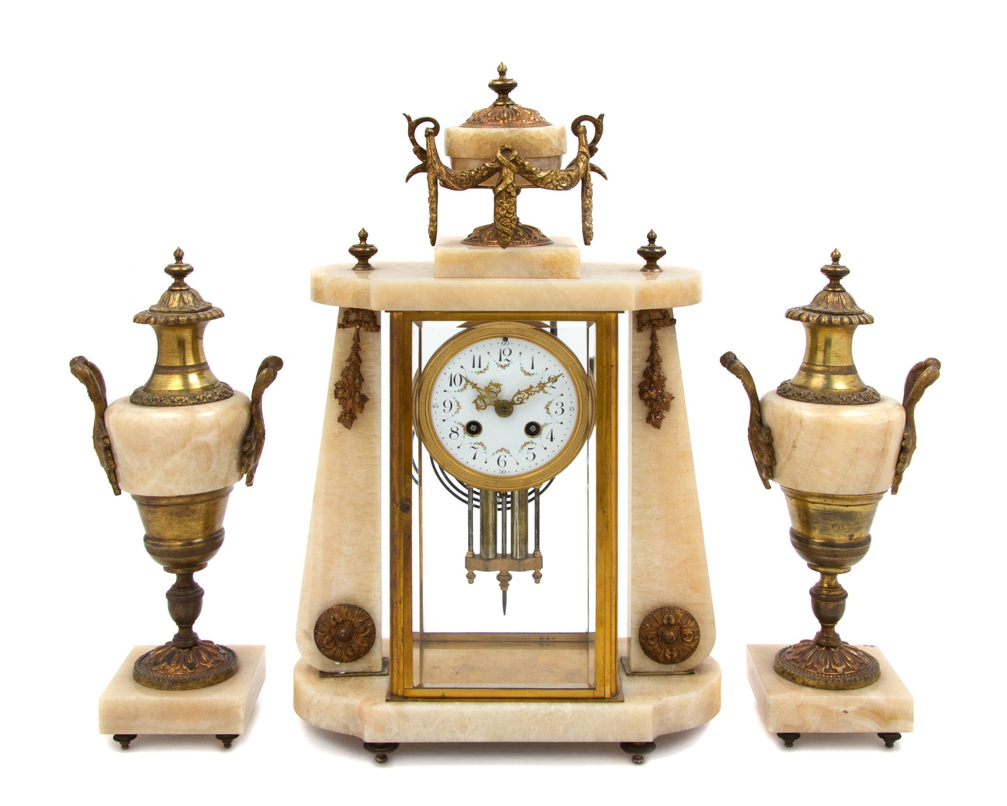 A French Onyx and Gilt Bronze Clock Garniture Height of clock 18 inches. — MOVEMENT BY FRITZ MARTI