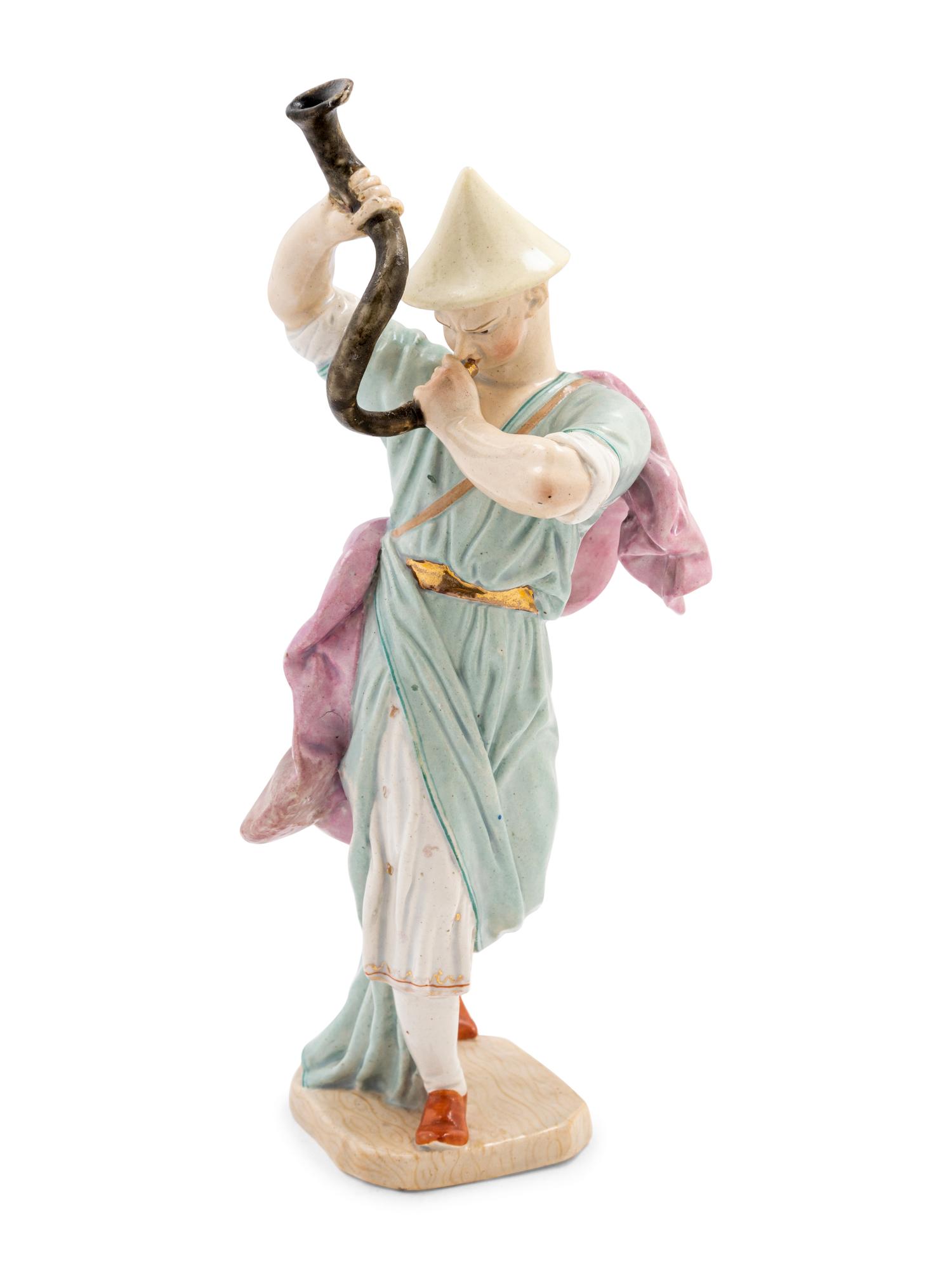 A Hochst Porcelain Figure of a Chinese Trumpeter