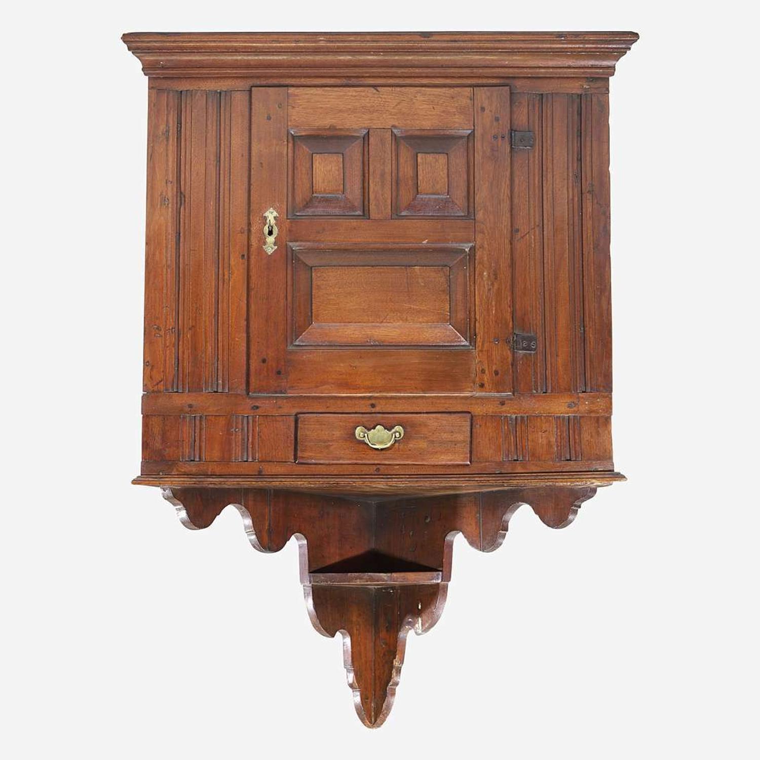 A Queen Anne walnut hanging corner cupboard Chichester, PA, circa 1750