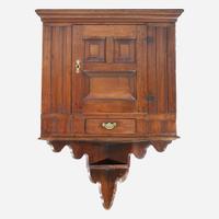 A Queen Anne walnut hanging corner cupboard Chichester, PA, circa 1750