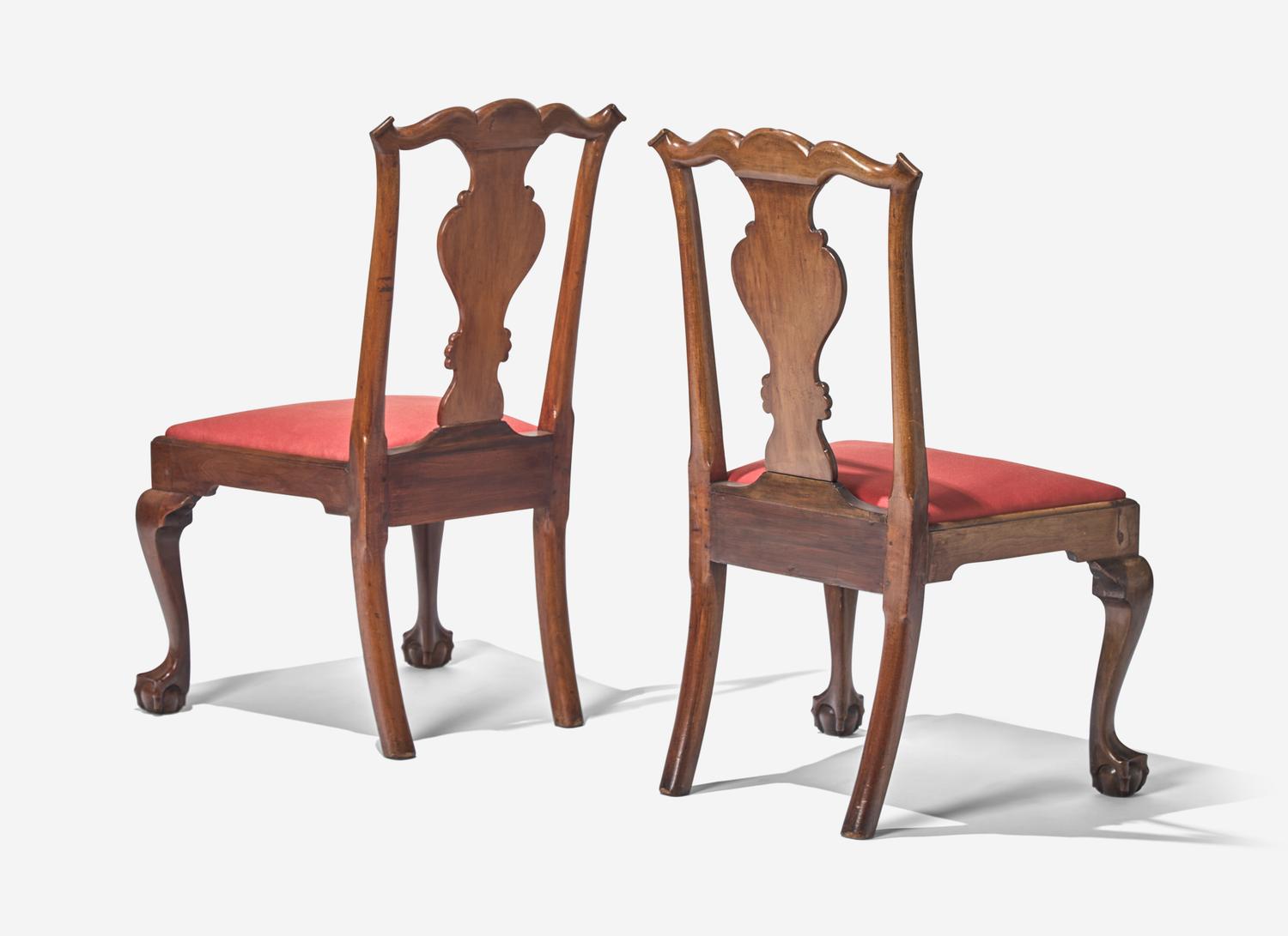 A Set of Four Chippendale Walnut Claw-and-Ball Foot Dining Chairs