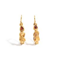 A Pair of Hellenistic Gold and Garnet Earrings with the God Eros